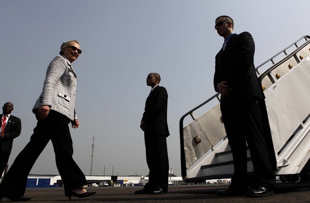 U.S. Secretary of State Hillary Clinton walks towards her jet before departing Liberia for Ivory Coast, in Monrovia