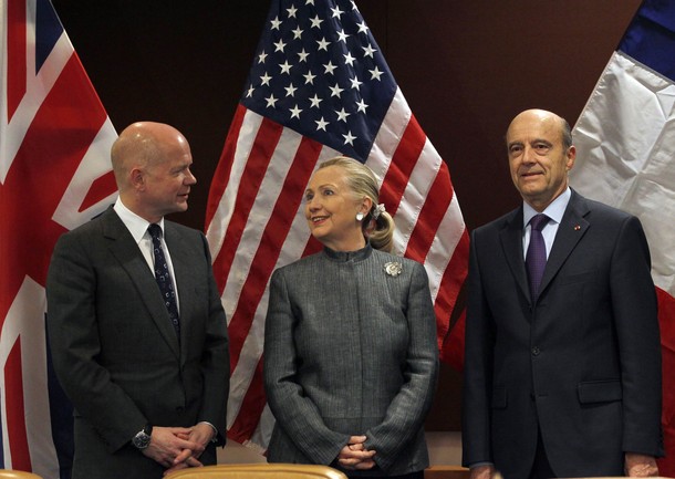 U.S. Secretary of State Hillary Clinton meets with French Foreign Minister Alain Juppe and British Foreign Minister William Hague before a UN Security Council meeting at the United Nations in New York