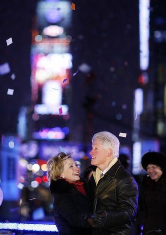 Former US President Clinton and his wife US Senator Hillary dance at midnight in Times Square during New Year festivities in New York