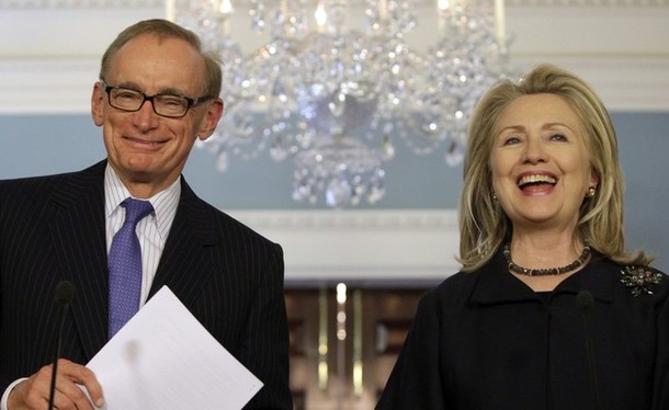 U.S. Secretary of State Hillary Clinton laughs with Australian Foreign Minister Bob Carr after their meeting at the State Department in Washington