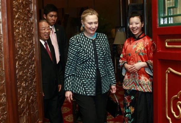 U.S. Secretary of State Hillary Clinton, center, enters a dinner with State Councilo rDai Bingguo, left, in Beijing, on Wednesday, May 2, 2012.  (AP Photo/Shannon Stapleton, Pool)