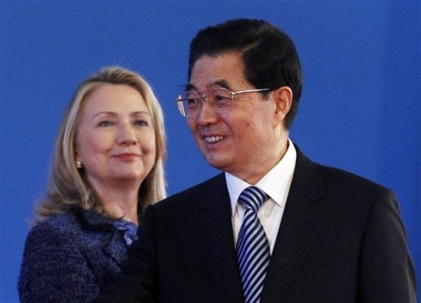 U.S. Secretary of State Hillary Rodham Clinton looks at Chinese President Hu Jintao smile during the opening ceremony of the U.S.- China Strategic and Economic Dialogue at the Diaoyutai state guesthouse in Beijing Thursday, May 3, 2012. (AP Photo/Shannon Stapleton, Pool)
