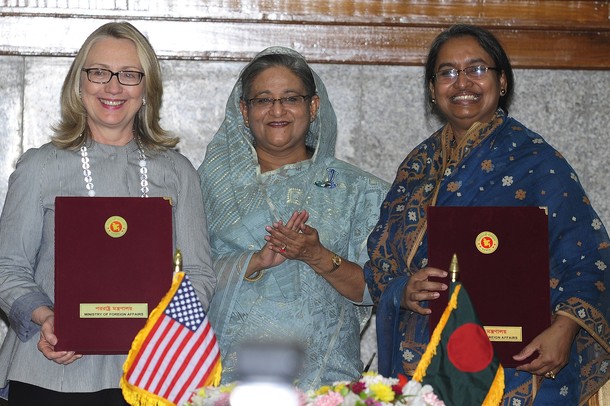Bangladesh prime minister Sheikh Hasina (C), U.S. Secretary of State Hillary Rodham Clinton (L) and Bangladesh Foreign Minster Dipu Moni (R) pose for a photo after signin an agreement in Dhaka on May 5, 2012. US Secretary of State Hillary Clinton arrived May 5 for a difficult mission in Bangladesh where violence and a crackdown on the opposition threaten new instability. Clinton, coming from a row in China over a Chinese dissident, was set to sign a new partnership agreement with the impoverished South Asian nation. AFP PHOTO/ Munir uz ZAMAN        (Photo credit should read MUNIR UZ ZAMAN/AFP/GettyImages)