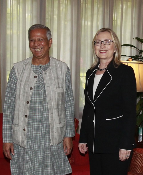 US Secretary of State Hillary Rodham Clinton (R) with Grameen Bank founder and Nobel laureate Muhammad Yunus pose in Dhaka on May 6, 2012. US Secretary of State Hillary Clinton threw her support May 6 behind microfinance pioneer Muhammad Yunus on a visit to Bangladesh, calling the embattled Nobel laureate a global inspiration. AFP PHOTO/ STR        (Photo credit should read STRDEL/AFP/GettyImages)