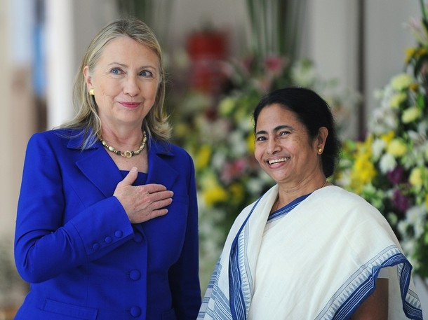US Secretary of State Hillary Clinton (L) looks on with India's West Bengal state Chief Minister Mamata Banerjee at the Writers' Building, which houses the state secretariat, in Kolkata on May 7, 2012.  US Secretary of State Hillary Clinton urged India May 7 to further cut its imports of Iranian oil, saying New Delhi should use its growing clout to help isolate the Islamic republic. AFP PHOTO/Dibyangshu SARKAR        (Photo credit should read DIBYANGSHU SARKAR/AFP/GettyImages)