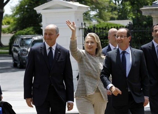 French President Francois Hollande, accompanied by Secretary of State Hillary Rodham Clinton, and French Foreign Minister Laurent Fabius leave the White House in Washington, Friday, May, 18. 2012. (AP Photo/Christophe Ena, Pool)