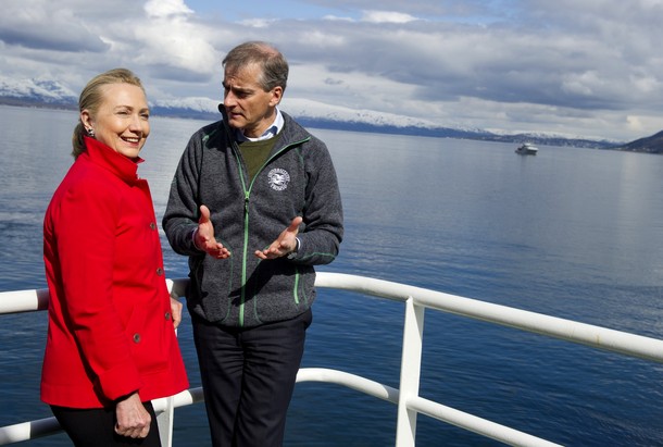 US Secretary of State Hillary Clinton and Norway's Minister of Foreign Affairs Jonas Gahr Stoere (R), talk onboard the Arctic Research Vessel Helmer Hanssen during a boat tour of a fjord off of Troms rway, in the Arctic Circle, June 2, 2012. AFP PHOTO / POOL / Saul LOEB        (Photo credit should read SAUL LOEB/AFP/GettyImages)