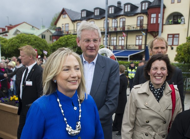 US Secretary of State Hillary Clinton (L), Swedish Defense Minister Karin Enstrom (R) and Swedish Foreign Minister Carl Bildt (C) walk back to their boat after greeting locals at Vaxholm Island near Stockholm on June 3, 2012. Clinton and Bildt took a boat from nearby Stockholm to the island to pick up Enstrom for a meeting on the boat trip back to the city. AFP PHOTO / POOL / Saul LOEB        (Photo credit should read SAUL LOEB/AFP/GettyImages)