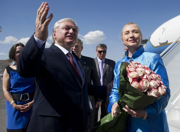 Armenia's Foreign Minister Edward Nalbandian (L) greets U.S. Secretary of State Hillary Clinton after her arrival at Yerevan International Airport in Yerevan June 4, 2012. REUTERS/Saul Loeb/Pool (ARMENIA - Tags: POLITICS)