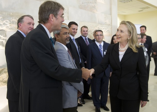 US Secretary of State Hillary Clinton (R) greets representatives of US-based oil and related companies as she tours the exhibits at the Caspian Oil and Gas Show at the Baku Expo Center in Baku, Azerbaijan, June 6, 2012. AFP PHOTO / POOL / Saul LOEB        (Photo credit should read SAUL LOEB/AFP/GettyImages)