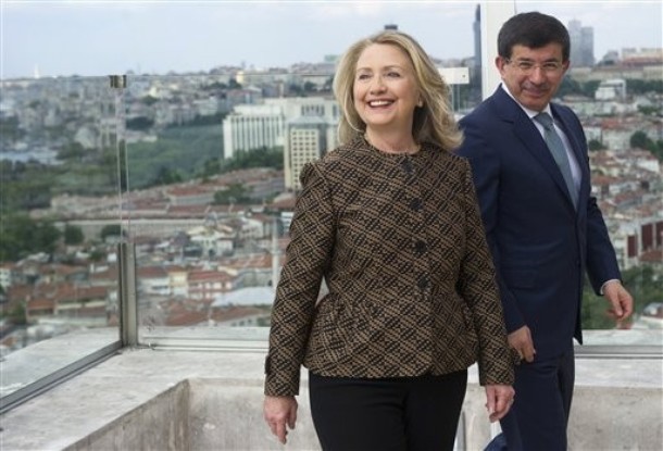 Turkish Foreign Minister Ahmet Davutoglu, left, and U.S. Secretary of State Hillary Rodham Clinton arrive for a meeting in Istanbul Thursday, June 7, 2012. (AP Photo/Saul Loeb, Pool)