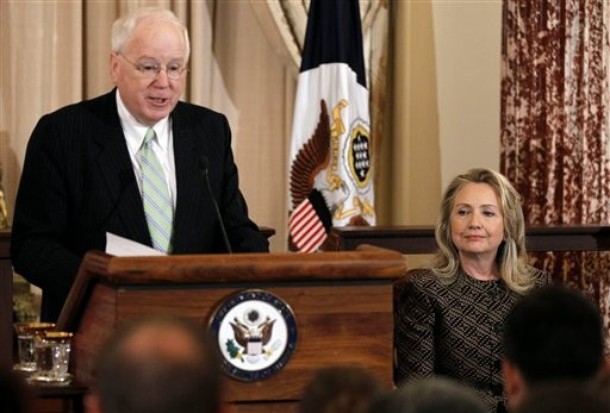Secetary of State Hillary Rodham Clinton listens at right as Ambassador Kenneth M. Quinn, President of the World Food Prize, speaks at the 2012 World Food Prize laureate announcement ceremony, Tuesday, June 12, 2012, at the State Department in Washington. (AP Photo/Pablo Martinez Monsivais)