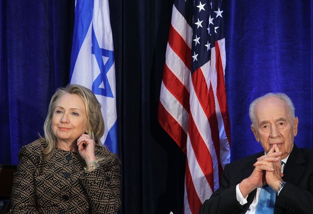 WASHINGTON, DC - JUNE 12:  U.S. Secretary of State Hillary Clinton (L) and Israeli President Shimon Peres (R) participate in a discussion at the Hay Adams Hotel June 12, 2012 in Washington, DC. The Clinton-Peres discussion was part of the 10th anniversary celebration of the Saban Center for Middle East Policy of Brookings Institution.  (Photo by Alex Wong/Getty Images)