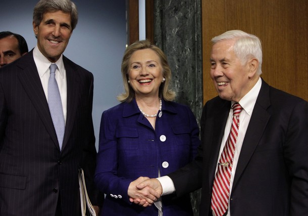 U.S. Secretary of State Hillary Clinton (C) shakes hands with Sen. Richard Lugar (R-IN) as Sen. John Kerry (D-MA) smiles, as she arrives to testify before the Senate Foreign Relations Committee hearing on Evaluating Goals and Progress in Afghanistan and Pakistan on Capitol Hill in Washington June 23, 2011. REUTERS/Yuri Gripas (UNITED STATES - Tags: POLITICS)