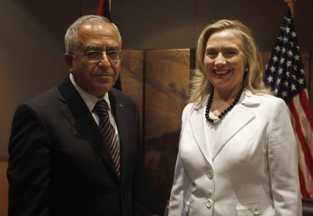 Palestinian Prime Minister Salam Fayyad stands with U.S. Secretary of State Hillary Clinton (R) before their meeting in Jerusalem July 16, 2012. REUTERS/Ammar Awad (JERUSALEM - Tags: POLITICS)