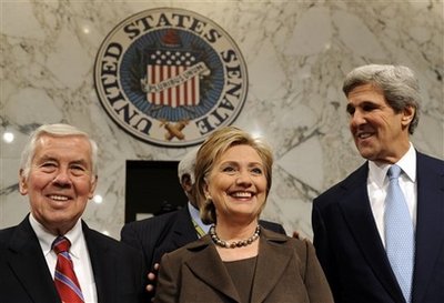Secretary of State-designate Sen. Hillary Rodham Clinton, D-N.Y., center, stands with Senate Foreign Relations Committee Chairman Sen. John Kerry, D-Mass., right, and the committee's ranking Republican Sen. Richard Lugar, R-Ind., on Capitol Hill in Washington, Tuesday, Jan. 13, 2009, before the start of her nomination hearing before the committee. (AP Photo/Susan Walsh)