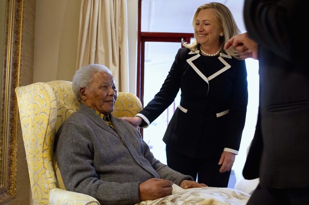 U.S. Secretary of State Hillary Clinton meets with Nelson Mandela at his home in QunU