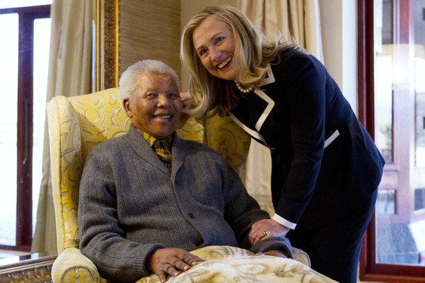 U.S. Secretary of State Hillary Clinton meets with Nelson Mandela at his home in Qunu