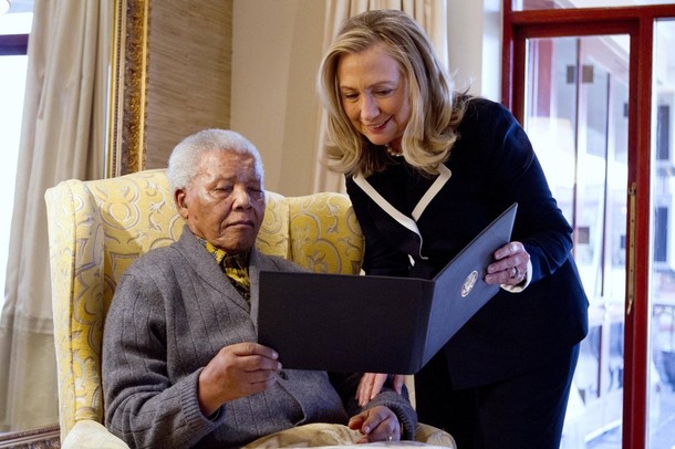 U.S. Secretary of State Hillary Clinton meets with Nelson Mandela at his home in Qunu