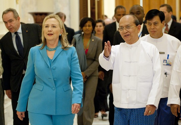 U.S. Secretary of State Hillary Clinton walks with Myanmar's President Thein Sein in between meetings at the President's Office in Naypyitaw