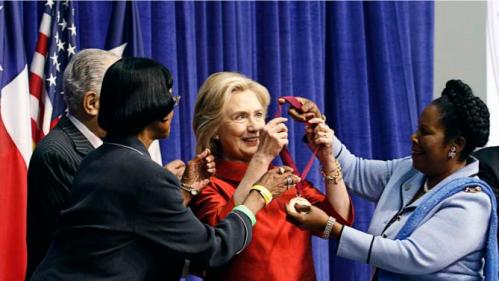 Democratic presidential candidate Hillary Clinton (C) receives the Barbara Jordan Public-Private Leadership Award  during an appearance at Texas Southern University in Houston June 4, 2015.   REUTERS/Donna Carson