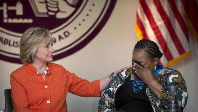 Democratic presidential candidate Hillary Rodham Clinton, left, comforts home care consumer Karen Johnson who became emotional while sharing her story during a roundtable discussion home care, Thursday, Aug. 6, 2015, in Los Angeles. (AP Photo/Jae C. Hong)