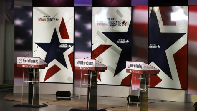 The podiums are seen on the stage during final preparations for Saturday night's Democratic presidential debate between Sen. Bernie Sanders, I-Vt,, Hillary Rodham Clinton and former Maryland Gov. Martin O'Malley, Friday, Nov. 13, 2015, in Des Moines, Iowa. (AP Photo/Charlie Neibergall)