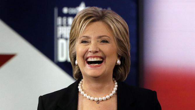 Hillary Rodham Clinton laughs during a commercial break at a Democratic presidential primary debate, Saturday, Nov. 14, 2015, in Des Moines, Iowa. (AP Photo/Charlie Neibergall)