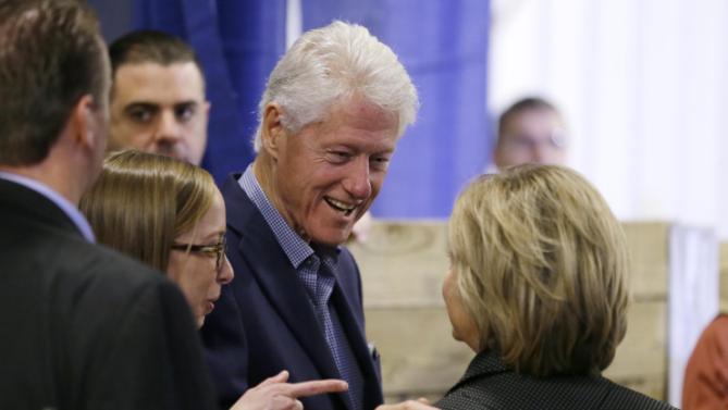 Former president Bill Clinton talks with his wife Democratic presidential candidate Hillary Rodham Clinton backstage at the Central Iowa Democrats Fall Barbecue Sunday, Nov. 15, 2015, in Ames, Iowa. (AP Photo/Charlie Neibergall)