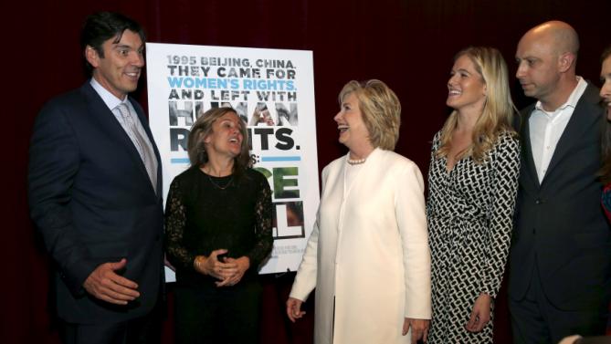 Democratic U.S. presidential candidate Hillary Clinton greets AOL CEO Tim Armstrong (L) as she arrives for the premiere of the documentary film "Makers: Once And For All" at the DOC NYC documentary film festival in the Manhattan borough of New York City, November 19, 2015. "Makers: Once And For All" tells the story of the 1995 Beijing Women's Conference and features commentary from the former U.S. First Lady and Secretary of State. Also pictured are director Dyllan McGee (2nd L), producer Samantha Leibovitz (2nd R) and director Michael Epstein (R). REUTERS/Mike Segar