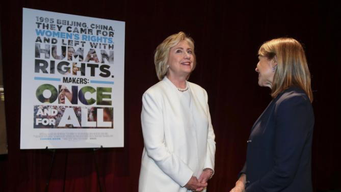Democratic presidential candidate Hillary Rodham Clinton, left, talks with Katie Couric before the premiere of the movie "Makers: Once and for All," Thursday, Nov. 19, 2015, in New York. The movie chronicles the months in 1995 leading up to the U.N. Fourth World Conference on Women in Beijing which Clinton attended. (AP Photo/Julie Jacobson)
