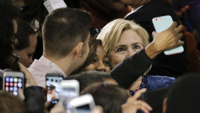 A supporter takes a selfie with Democratic presidential candidate Hillary Rodham Clinton  at Fisk University Friday, Nov. 20, 2015, in Nashville, Tenn. (AP Photo/Mark Humphrey)