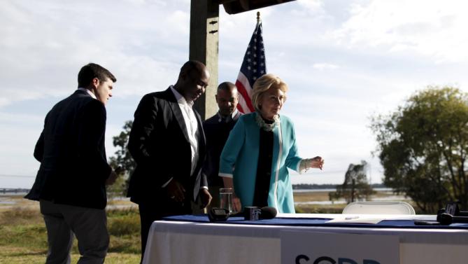 U.S. Democratic presidential candidate Hillary Clinton (R) prepares to register as a candidate for the South Carolina primary after her speech at the annual Blue Jamboree in the Lowcountry at the Jenkins Institute for Children in North Charleston, South Carolina November 21, 2015. REUTERS/Randall Hill