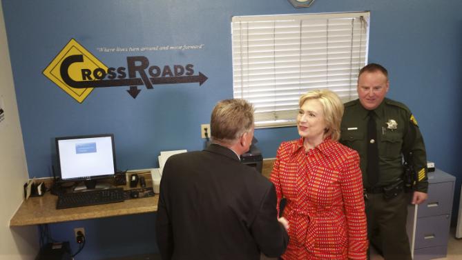 Democratic presidential candidate Hillary Rodham Clinton meets Steven Edwards, program manager at the Crossroads substance abuse treatment center during a campaign stop Monday, Nov. 23, 2015 in Reno, Nev. Clinton said she hoped the program could be replicated elsewhere. (AP Photo/Michelle Rindels)