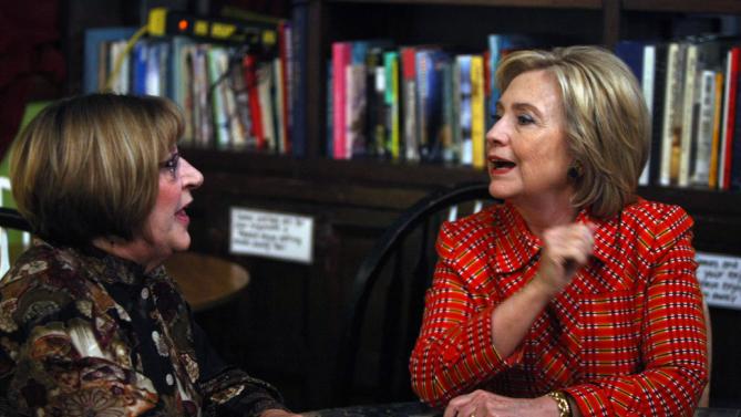 Democratic presidential candidate Hillary Rodham Clinton meets with Democratic Party chairman Marty McGarry at the Comma Coffee House in Carson City, Nev., Monday, Nov. 23, 2015, (AP Photo/Lance Iversen)