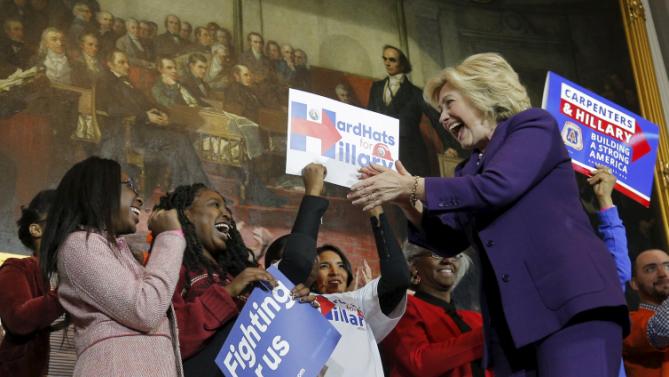 U.S. Democratic presidential candidate Hillary Clinton greets supporters representing labor unions as she takes the stage for a campaign rally at Faneuil Hall in Boston, Massachusetts November 29, 2015. REUTERS/Brian Snyder