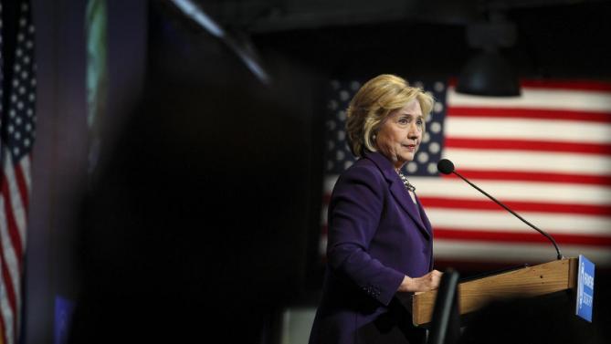Democratic presidential candidate Hillary Clinton pauses while speaking at the at New Hampshire Democrats party's annual dinner in Manchester, N.H., Sunday, Nov. 29, 2015. (AP Photo/Cheryl Senter)