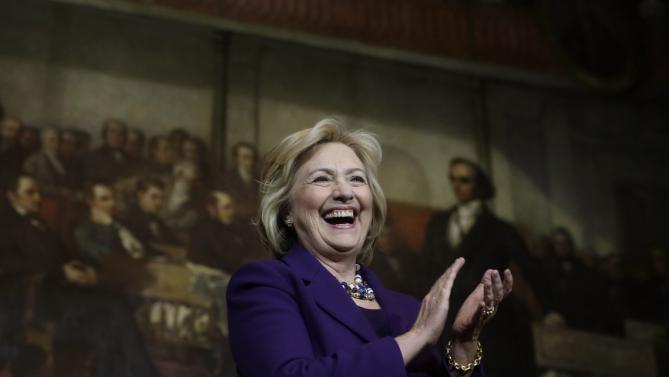 Democratic presidential candidate Hillary Clinton smiles on stage at the start of a rally, Sunday, Nov. 29, 2015, in Boston. Clinton and Boston Mayor Marty Walsh attended the event to launch "Hard Hats for Hillary," a coalition to organize working families in construction, building, transportation, and other labor industries to support Clinton's agenda. (AP Photo/Steven Senne)