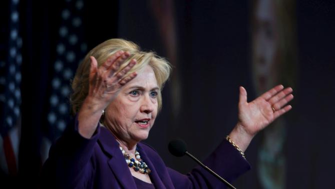 U.S. Democratic presidential candidate Hillary Clinton gestures as she speaks at the New Hampshire Democratic Party's Jefferson Jackson dinner in Manchester, New Hampshire November 29, 2015. REUTERS/Mary Schwalm