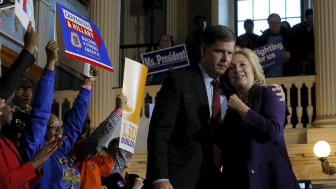 Boston Mayor Marty Walsh hugs U.S. Democratic presidential candidate Hillary Clinton (R) at the conclusion of a campaign rally with labor unions at Faneuil Hall in Boston, Massachusetts November 29, 2015. Walsh endorsed Clinton at the rally. REUTERS/Brian Snyder