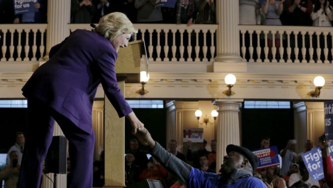 U.S. Democratic presidential candidate Hillary Clinton greets an audience member at the conclusion of a campaign rally with labor unions at Faneuil Hall in Boston, Massachusetts November 29, 2015. REUTERS/Brian Snyder