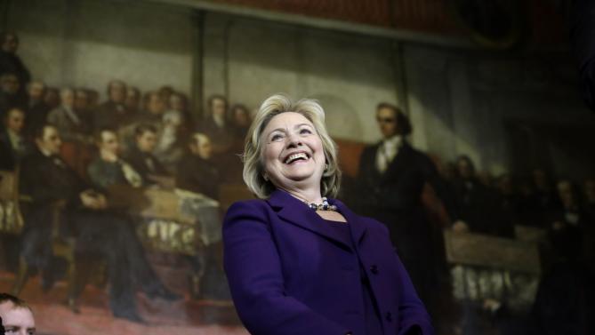 Democratic presidential candidate Hillary Clinton smiles on stage at the start of a rally, Sunday, Nov. 29, 2015, in Boston. Clinton and Boston Mayor Marty Walsh attended the event held to launch “Hard Hats for Hillary," a coalition to organize working families in construction, building, transportation, and other labor industries to support Clinton's agenda. (AP Photo/Steven Senne)