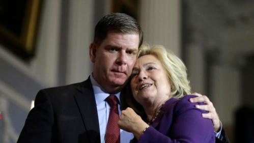 Democratic presidential candidate Hillary Clinton, right, and Boston Mayor Marty Walsh, left, embrace on stage at the conclusion of a rally at Faneuil Hall, Sunday, Nov. 29, 2015, in Boston. The event was held to launch Hard Hats for Hillary," a coalition created to organize people in industries and labor to support Clinton's agenda. (AP Photo/Steven Senne)