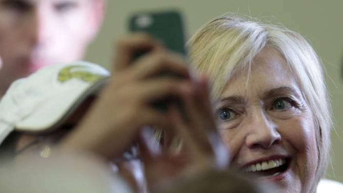 U.S. Democratic presidential candidate Hillary Clinton takes a selfie after speaking at an election campaign event in Orlando, Florida December 2, 2015.  REUTERS/Scott Audette
