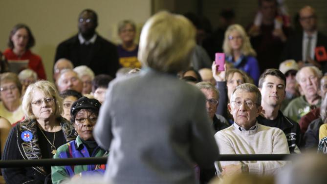 Audience members listen as Democratic presidential candidate Hillary Clinton speaks during a town hall meeting, Wednesday, Dec. 9, 2015, in Waterloo, Iowa. (AP Photo/Charlie Neibergall)