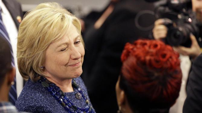 Democratic presidential candidate Hillary Clinton winks as she speaks to Lesley McSpadden, right, the mother of Michael Brown, while working the rope line during a campaign stop at a union hall on Friday, Dec. 11, 2015, in St. Louis. Brown was shot and killed by a Ferguson police officer in Aug. 2014 setting off the Black Lives Matter movement. (AP Photo/Jeff Roberson)