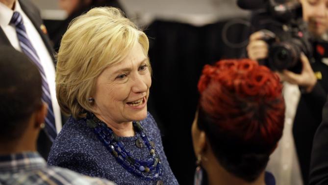 Democratic presidential candidate Hillary Clinton speaks to Lesley McSpadden, right, the mother of Michael Brown, while working the rope line during a campaign stop at a union hall on Friday, Dec. 11, 2015, in St. Louis. Brown was shot and killed by a Ferguson police officer in Aug. 2014 setting off the Black Lives Matter movement. (AP Photo/Jeff Roberson)