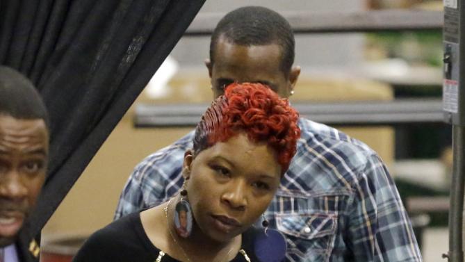 Lesley McSpadden, the mother of Michael Brown, enters a event for Democratic presidential candidate Hillary Clinton at a union hall on Friday, Dec. 11, 2015, in St. Louis. Brown was shot and killed by a Ferguson police officer in Aug. 2014 setting off the Black Lives Matter movement. (AP Photo/Jeff Roberson)