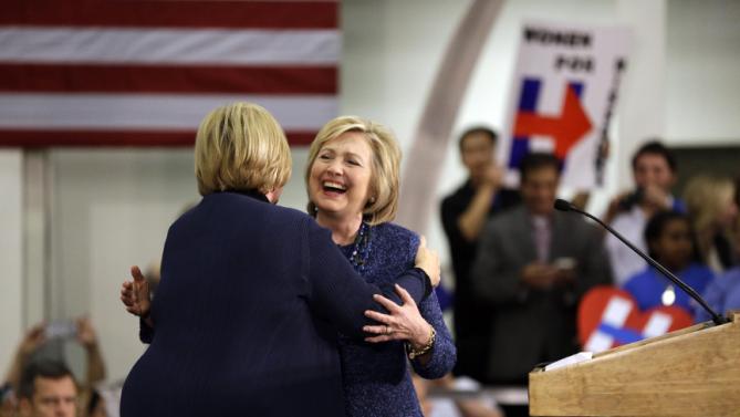 Democratic presidential candidate Hillary Clinton hugs Sen. Claire McCaskill, D-Mo., left, before speaking to supporters during a campaign stop at a union hall on Friday, Dec. 11, 2015, in St. Louis. (AP Photo/Jeff Roberson)