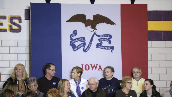 Audience members wait for Democratic presidential candidate Hillary Clinton to arrive at a town hall meeting at Keota High School, Tuesday, Dec. 22, 2015, in Keota, Iowa. (AP Photo/Charlie Neibergall)